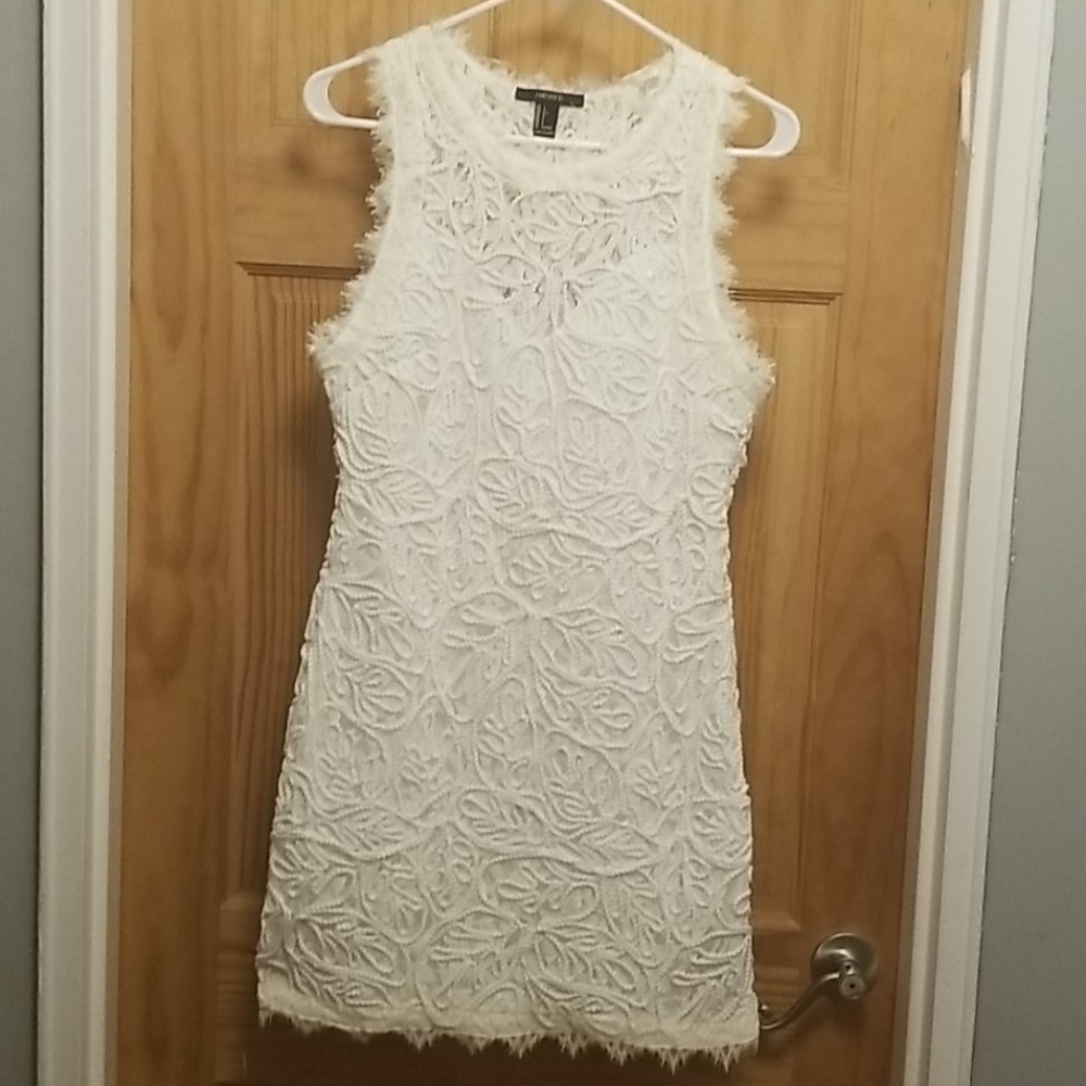 White lace patterned mini dress tagless but new.